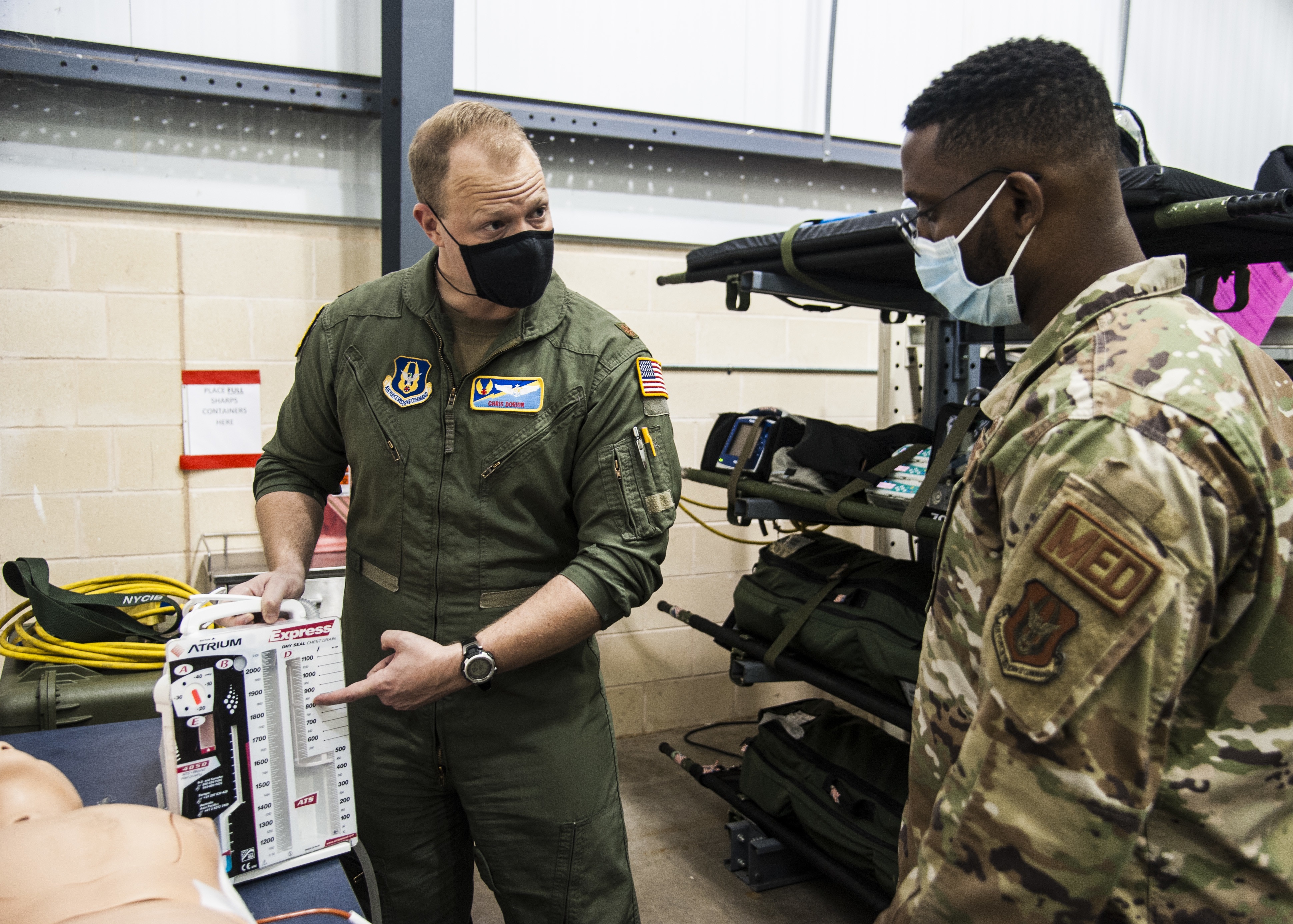 U.S. Air Force Major Chris Dorion, 45th Aeromedical Evacuation Squadron flight nurse teaches U.S. Air Force Senior Airman Harelimana Mhayamaguru 45 AES air evacuation technician, about the dry seal chest drainer on Oct. 3, 2020 at MacDill Air Force Base, FL. The Express chest drain integrates precision dry suction regulation, and a dry seal one-way valve technology for patient safety.